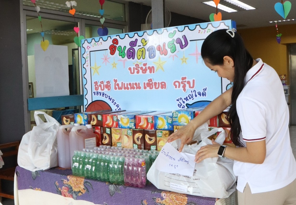 EBC Team Member handling food donations to the foundation.